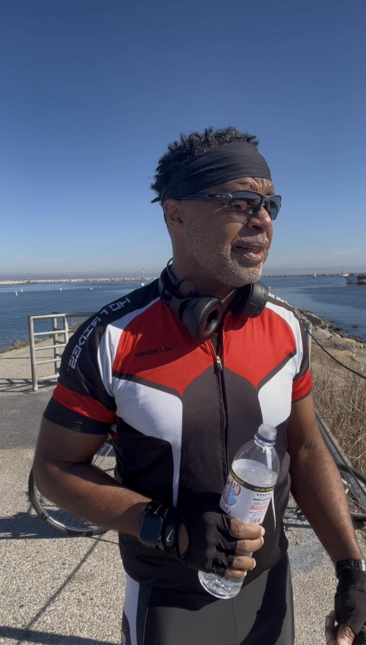 Eric Kemp in cycling gear with his bicycle